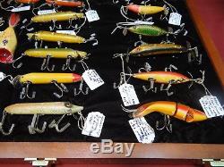 Collection of Antique Heddon Fishing Lures in Walnut Display Case