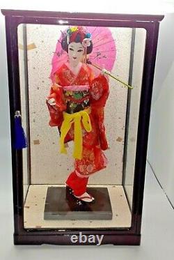 Japanese geisha doll in glass/wood display case