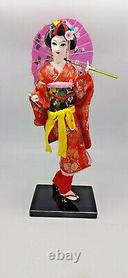 Japanese geisha doll in glass/wood display case