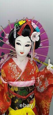 Japanese geisha doll in glass/wood display case