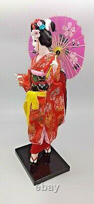 Japanese geisha doll in glass/wood display case