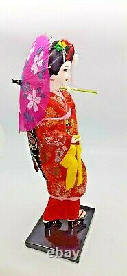 Japanese geisha doll in glass/wood display case