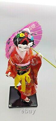 Japanese geisha doll in glass/wood display case