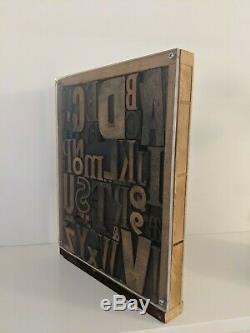 Vintage letterpress wood type printing blocks alphabet letters in display case