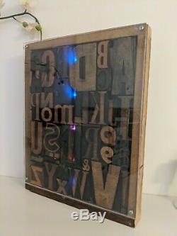 Vintage letterpress wood type printing blocks alphabet letters in display case